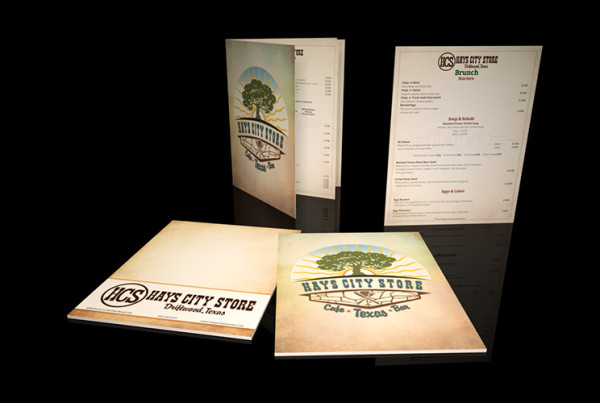 Photo of Hays City Store restaurant menus Driftwood Texas. Brunch and regular menus displayed on black background large